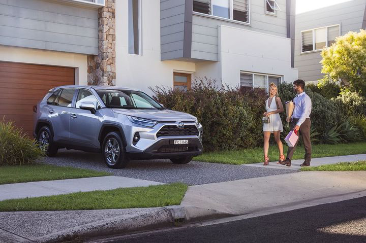 Toyota RAV4 in a suburban driveway, Shanti Griffin walking up the path
